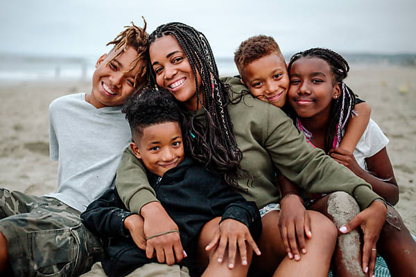 A family gathers together outdoors